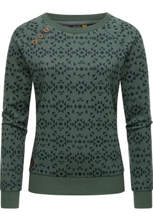 Grüner Pullover mit langen Ärmeln, dunklem geometrischem Muster und drei Holzknöpfen auf der linken Schulter.