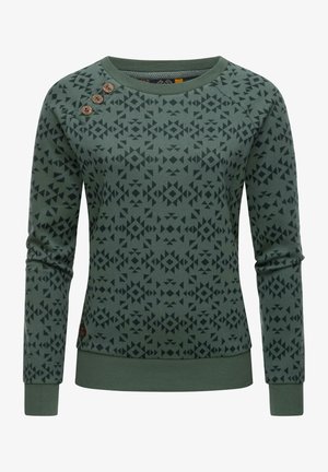 Sweat-shirt vert à manches longues avec un motif géométrique foncé et trois boutons en bois sur l'épaule gauche.