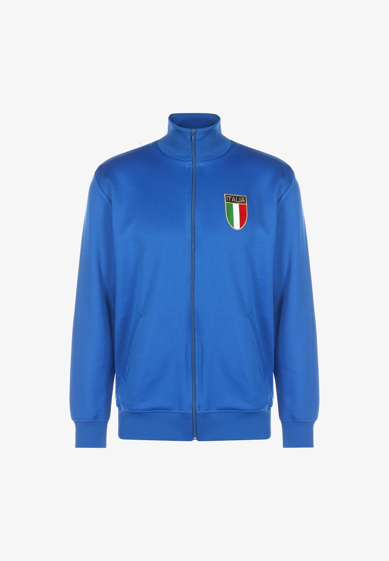Chaqueta azul con cremallera y cuello alto, que presenta un parche de "ITALIA" y franjas en verde, blanco y rojo. Confeccionada en un tejido suave y ligero.