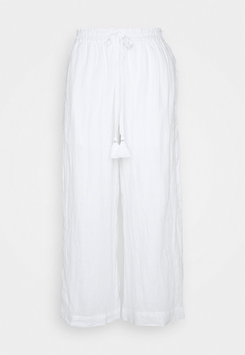 Bílé lněné kalhoty s volným střihem, elastickým pasem a šňůrkovým zapínáním, na přední straně se dvěma bílými třásněmi.
