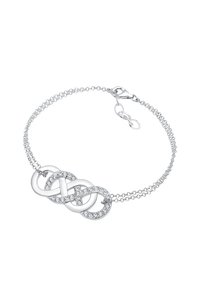 Silverfärgad armband med tre sammanlänkade ringar, prydda med små klara kristaller, och ett delikat kedjesystem med lås.