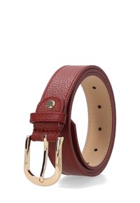Red textured leather belt rolled with gold metal buckle and stitched edges, showing multiple adjustment holes on inner side.