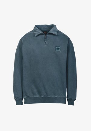 Halbzip-Pullover-Sweatshirt in verblasstem Blau, aus weichem Baumwoll-Mischgewebe. Verfügt über einen strukturierten Kragen und ein gesticktes Elefant-Logo auf der Brust.