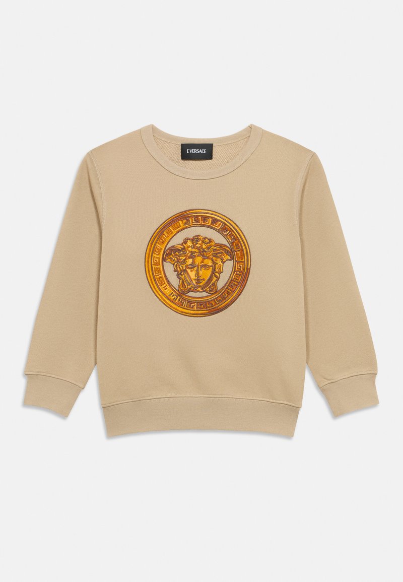 Μπεζ φούτερ με μεγάλο, κεντητό χρυσό και πορτοκαλί ελληνικό μοτίβο στο κέντρο μπροστά. Λαιμόκοψη crew και ριμπ μανσέτες.