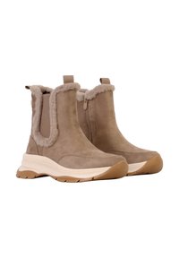 Bottines beiges en daim avec doublure en fourrure douce, panneaux latéraux élastiques et semelle intermédiaire blanche. Dotées d'une semelle extérieure en caoutchouc texturée pour une meilleure adhérence.