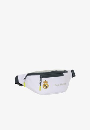 Biało-szara nerka z czarnymi zamkami błyskawicznymi, neonowożółtymi uchwytami do zamków, logo Real Madryd oraz tekstem z przodu.