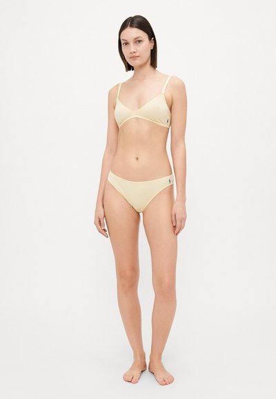 Yellow cotton bikini set with a triangle bralette and matching briefs. Features thin straps and a small logo accent on the side.