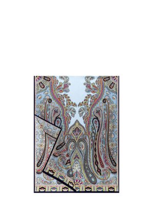 Blue fabric with intricate multicolored paisley and floral patterns, one corner folded to show the reverse side and black edging.