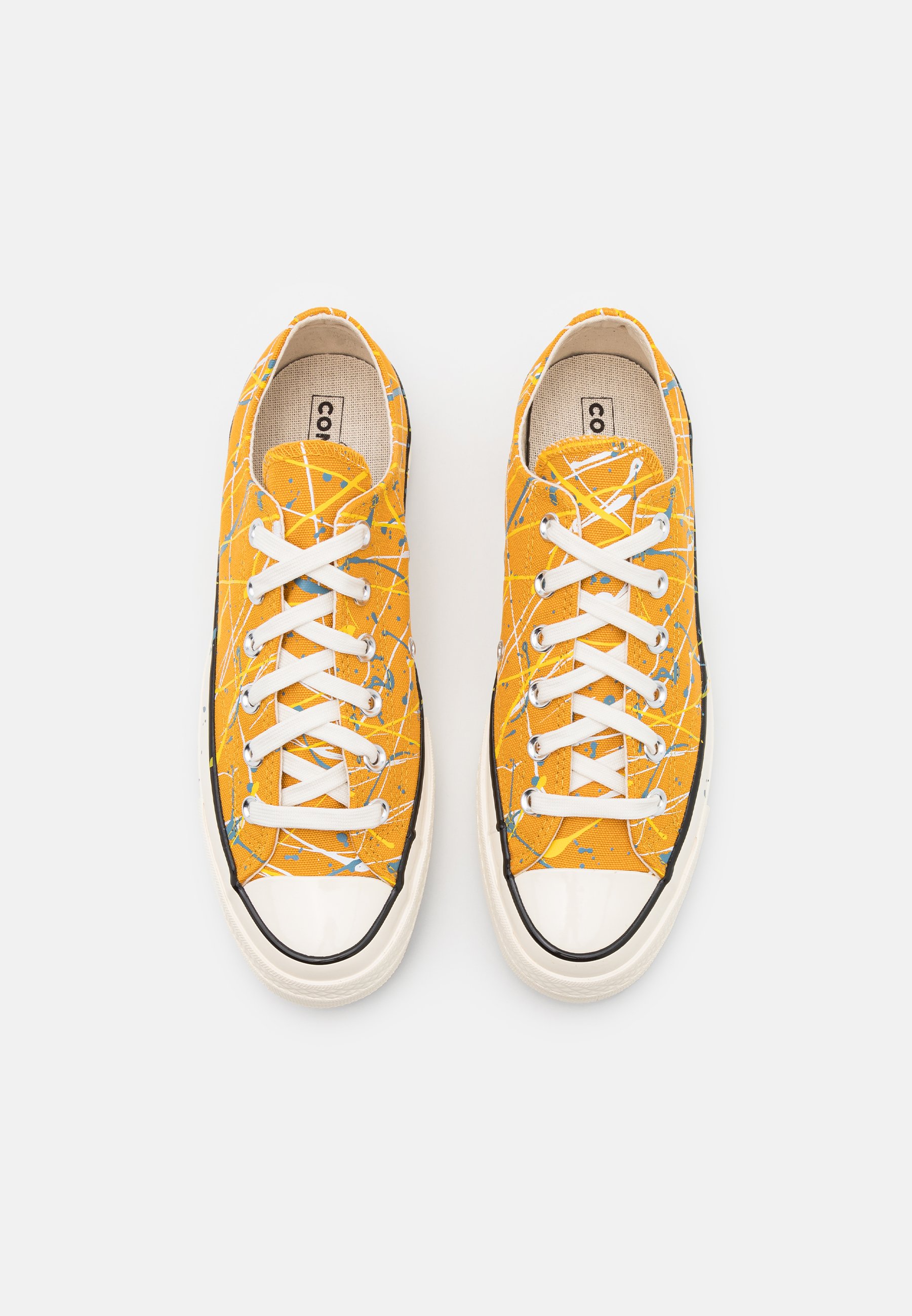 converse paint splatter low