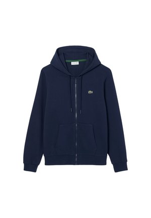 Felpa con cappuccio blu navy con zip, realizzata in tessuto morbido, con tasca a marsupio, cappuccio con coulisse e un piccolo logo verde sul petto.