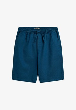 Tumedad sinised lühiqüljed, millel on elastne vöökoht ja nöör. Omab kahte küljetaskut ning laia, sirget lõiget. Valmistatud kergest kangast.