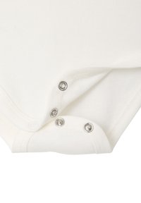 White cotton bodysuit featuring snap closures at the bottom and soft fabric texture. Clean design with minimal detailing.