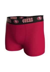 Punaiset bokserishortsit, joissa on musta joustava vyötärönauha, jossa on 49ersin logo ja nimi valkoisella ja kultaisella tekstillä. Tasainen pinta, istuva malli.