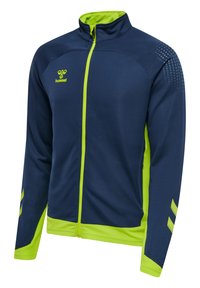 Sportstrøje med lynlås i navyblå og neon gul med høj krave, hummel-logo på brystet og Chevron-mønstre på ærmerne.