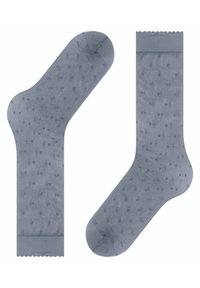 Hellgraue Socken mit transparenter Textur, die mit kleinen Punktemustern verziert sind und einen gewellten oberen Rand haben. Standard-Sockenform.
