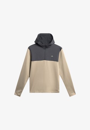 Capuchontrui met een ritssluiting bij de kraag, met een grijs bovenstuk en een beige onderstuk. Soepel materiaal met een logodetail.