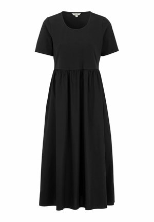 Black cotton dress with short sleeves, round neckline, and an empire waist that transitions to a full, flowing skirt. Smooth texture.