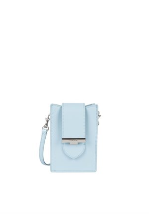 Light blue leather crossbody bag with a structured shape, fold-over flap, silver hardware, and adjustable strap. Modern and minimal design.