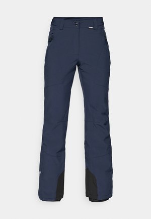 Navy ski pants made from weather-resistant fabric. Loose fit with zippers on pockets and black accents at the ankles. Reinforced seams.