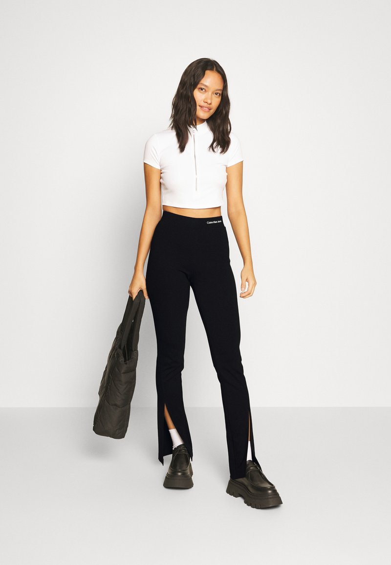 Calvin Klein Jeans SPLIT HEM SLIM MILANO PANTS - Trousers - black 