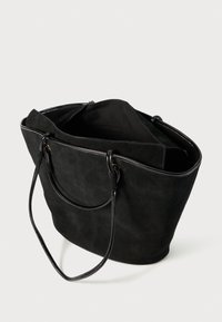 Black suede tote bag with two long handles, open top, and a spacious interior. Smooth texture with a simple design and minimal accents.
