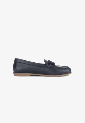 Black leather loafer with bow detail and flat tan sole, shown from side on a white background.