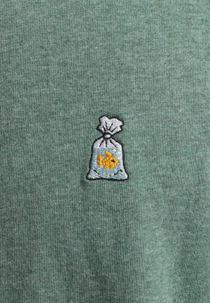 Green cotton fabric featuring an embroidered gray bag with a fish inside. Textured background with subtle ribbing.