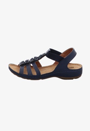 Navy blue sandal with floral accents, open toe, adjustable strap, cork insole, and rubber sole for comfort and support.