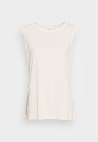 Débardeur crème sans manches en tissu doux, doté d'un col rond et d'une coupe décontractée. Design simple sans embellissements.