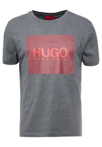 Gray cotton t-shirt with a crew neck. Features a rectangular red and pink graphic with the text "HUGO HUGO BOSS" in bold letters.