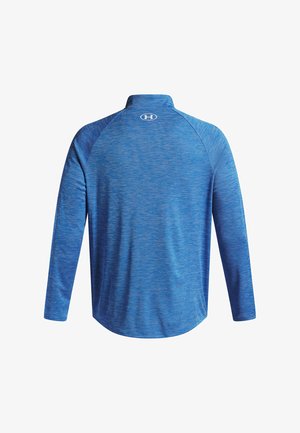 Zila gara piedurkne krekls ar augstu apkakli, viļņveidīgu tekstūru un logo aizmugurē. Izgatavots no mitrumu uztveroša auduma.