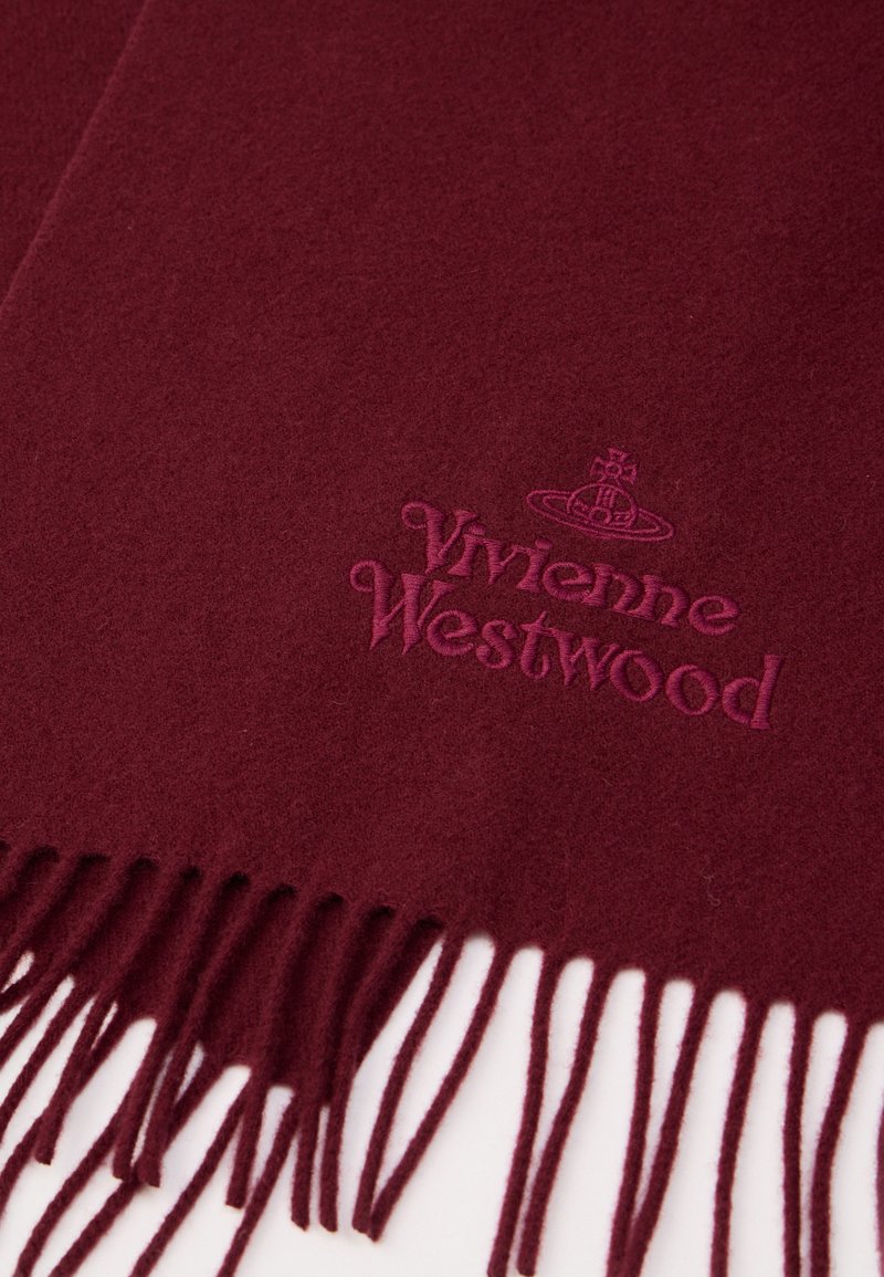 Burgunderfarvet uldtørklæde med frynser, prydet med præget "Vivienne Westwood" logo i en mørkere burgunderfarve. Blød tekstur.