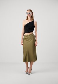 DRYKORN URA - A-silueta svārki - green