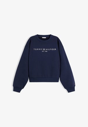 Sweat-shirt bleu marine Tommy Hilfiger avec poignets et ourlet côtelés, col rond, et texte logo blanc "TOMMY HILFIGER EST. 1985" sur le devant.