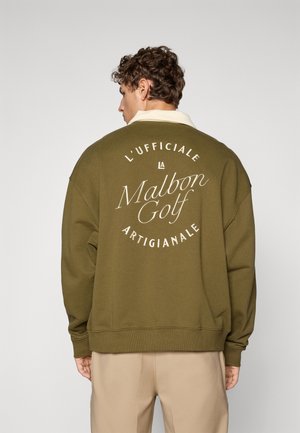 Sweatshirt oversize verde oliva con testo grafico bianco sul retro, caratterizzato da un orlo e un colletto a coste. Tessuto morbido.