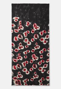 Tissu noir avec un motif floral en rouge et blanc. Surface texturée avec des formes variées de fleurs et des détails subtils.