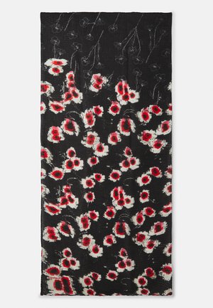 Tissu noir avec un motif floral en rouge et blanc. Surface texturée avec des formes variées de fleurs et des détails subtils.