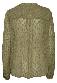 Blouse manches longues vert olive avec motif floral en relief texturé et détail froncé sous le yoke au dos.