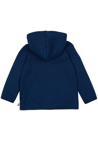 Giacca a vento blu navy realizzata in tessuto texturizzato. Presenta maniche lunghe, un design a coste e una piccola etichetta colorata sull'orlo inferiore.