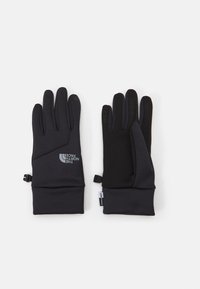 Sorte hansker med et elegant design, laget av et mykt materiale, med teksturert grep på håndflaten, og en logo på håndleddsområdet.