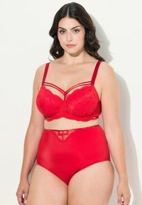 Red lingerie set featuring a lace-trimmed underwire bra with geometric patterns and matching high-waisted briefs with lace accents.
