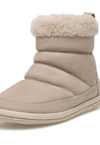 Bottine beige avec un revers en fausse fourrure doux et texturé, bout rond et semelle en caoutchouc épaisse et flexible avec des motifs de grip subtils.