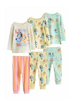 Three sets of children's long-sleeve tops and pants with colorful cartoon dog characters and "Let's Dance" text, in beige, yellow, mint, and striped pink.