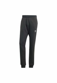 Pantaloni della tuta neri Adidas con vita e polsini elasticizzati, tasche laterali e logo trefoil bianco Adidas sulla coscia sinistra.