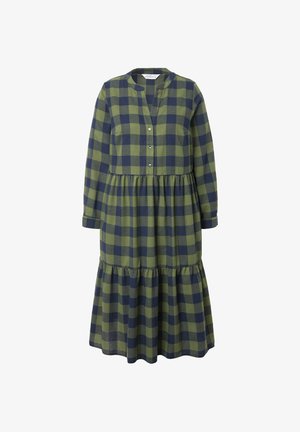 Zielona i granatowa sukienka w kratę z długimi rękawami, z guzikiem i warstwowym dołem. Wykonana z miękkiego materiału, o luźnym kroju.