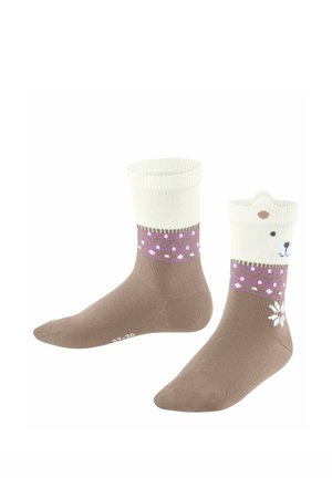 Calzini marroni e bianchi con polsini viola decorati, uno con faccia e orecchie di orso sul polsino e un fiocco di neve bianco vicino alla caviglia.