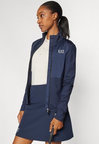 EA7 Emporio Armani GOLF PRO  - Běžecká bunda - blue