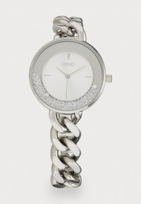 Silver watch with a smooth, round face, featuring a white dial, three markers, and a chain-link bracelet with crystal accents.