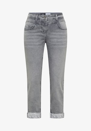 Grey denim jeans with rolled cuffs showing a white and grey leaf pattern, front button, zipper, and five-pocket design.