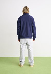 Carhartt WIP HALF ZIP AMERICAN SCRIPT - Sweatshirt - air force blue